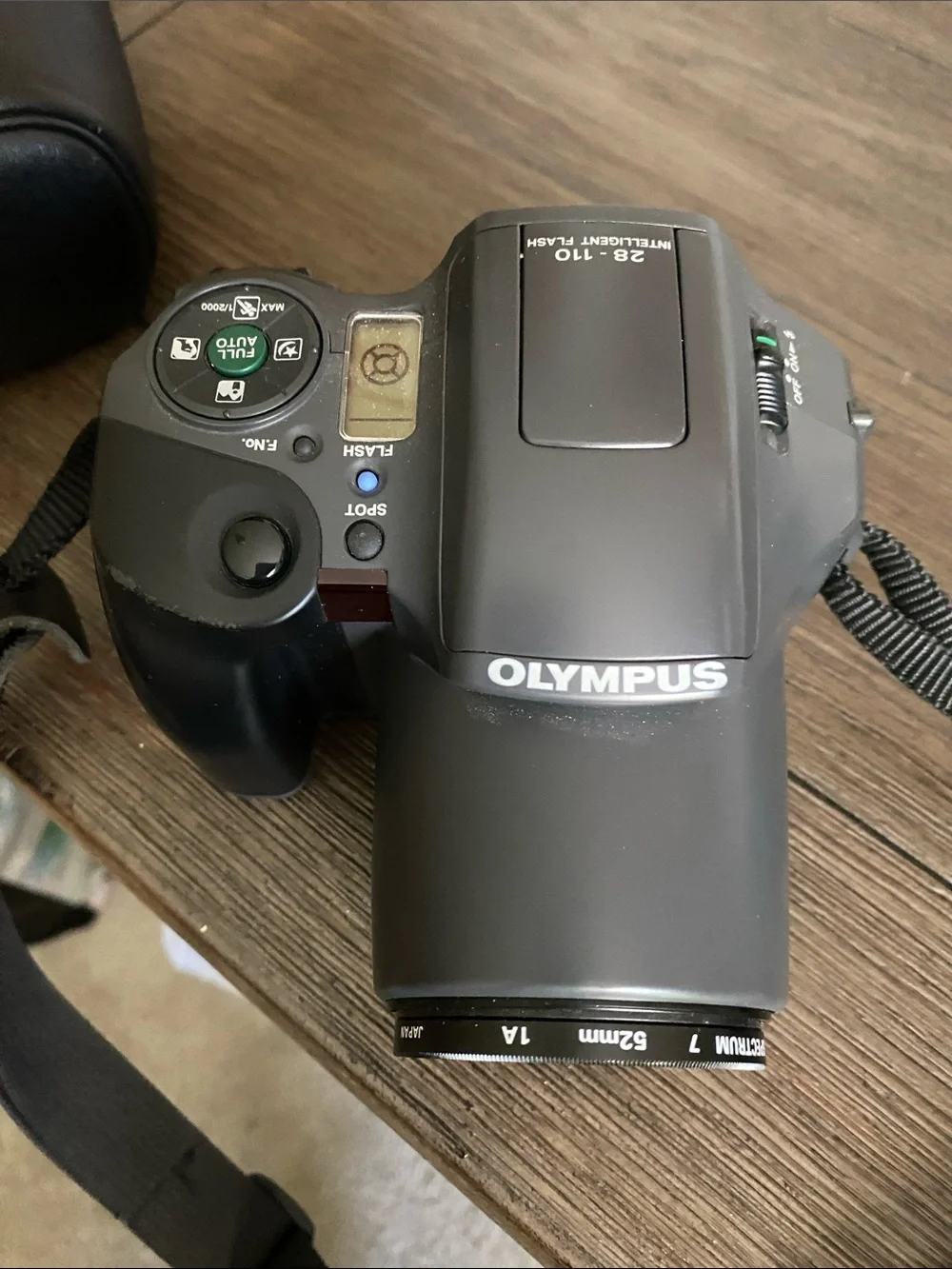 Olympus Digital Camera IS10 with Built-In Flash and Strap